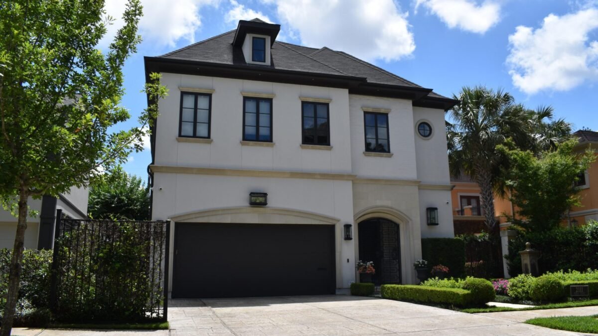 Stamped concrete driveway in front of a two-story house, from our concrete driveway cost guide