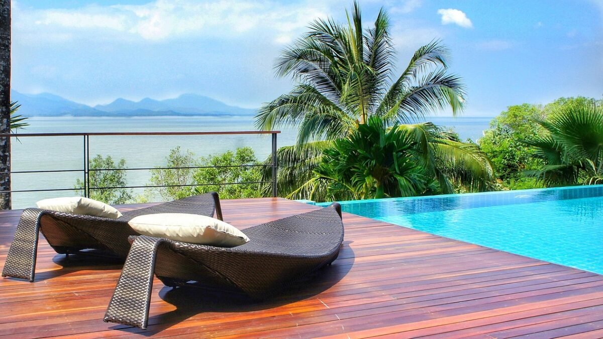 Wooden pool deck with lounge chairs at a resort