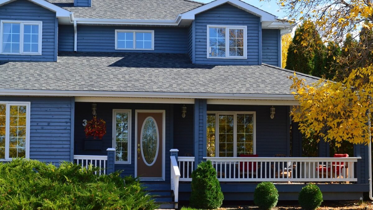 Two-story house with blue lap siding and a front porch